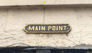 Street sign named Main Point