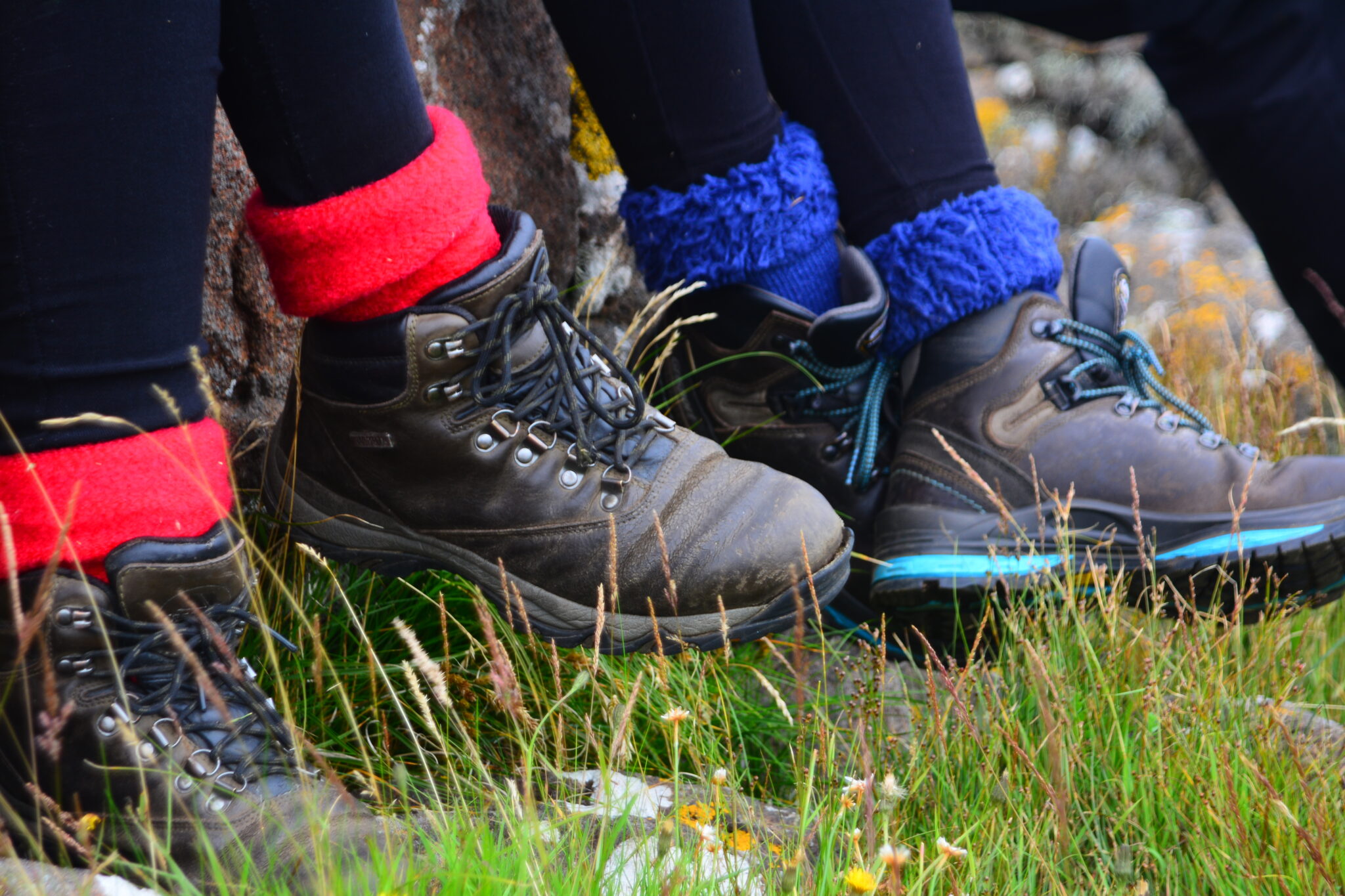 Two pairs of booted feet relating together