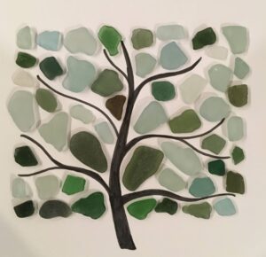 a tree picture made of sea glass pieces